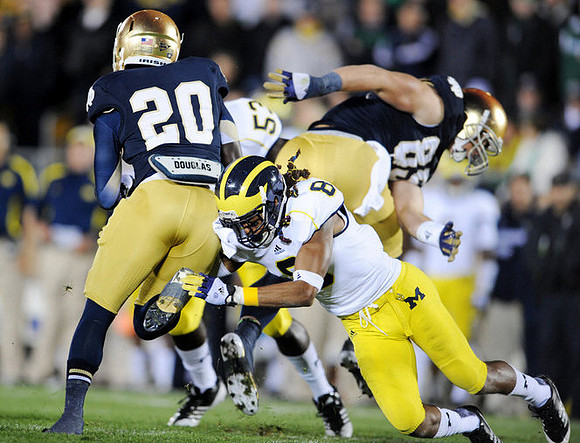 J.T. Floyd (8) and Mario Ojemudia (53)
