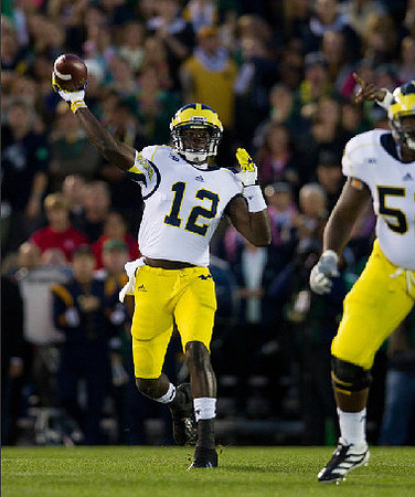 Devin Gardner (12) and Ricky Barnum (52)