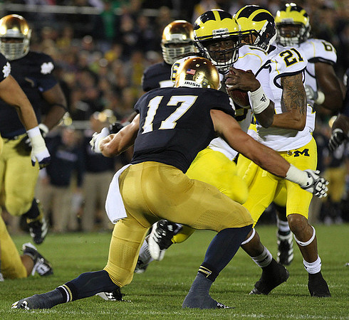 Denard Robinson (16), Roy Roundtree (21), and Patrick Omameh (65)