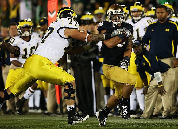 Taylor Lewan (77) and Jeremy Gallon (10)