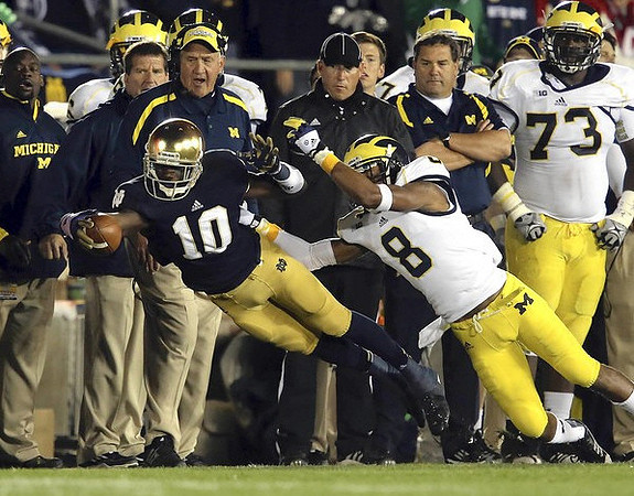 J.T. Floyd (8), Greg Mattison, Brady Hoke, and William Campbell (73)