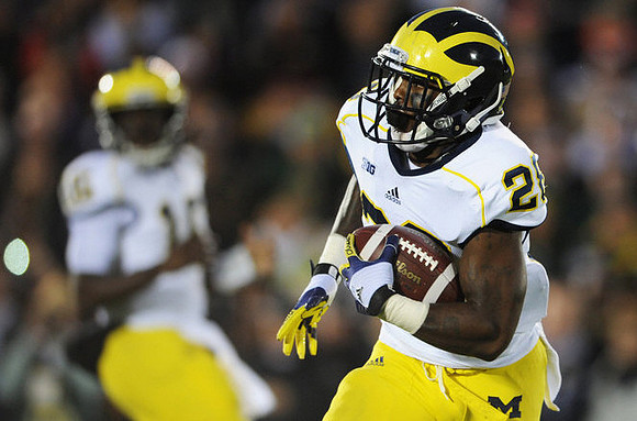 Fitzgerald Toussaint (28) and Denard Robinson (16)