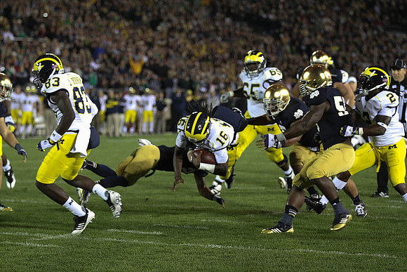 Jerald Robinson (83), Denard Robinson (16), Patrick Omameh (65), and Vincent Smith (2)