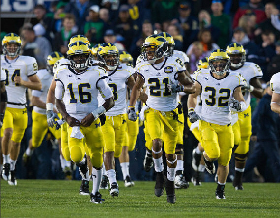 Denard Robinson (16), Roy Roundtree (21), and Jordan Kovacs (32)