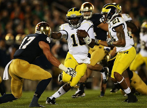 Denard Robinson (16) and Roy Roundtree (21)