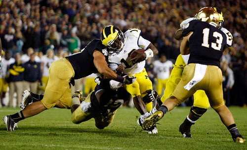 Denard Robinson (16) and Michael Schofield (75)