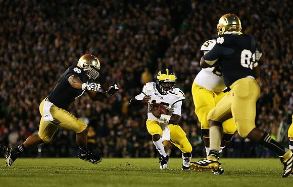 Denard Robinson (16) and Patrick Omameh (65)