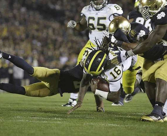 Denard Robinson (16) and Patrick Omameh (65)