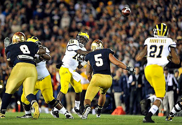 Patrick Omameh (65), Denard Robinson (16), and Roy Roundtree (21)