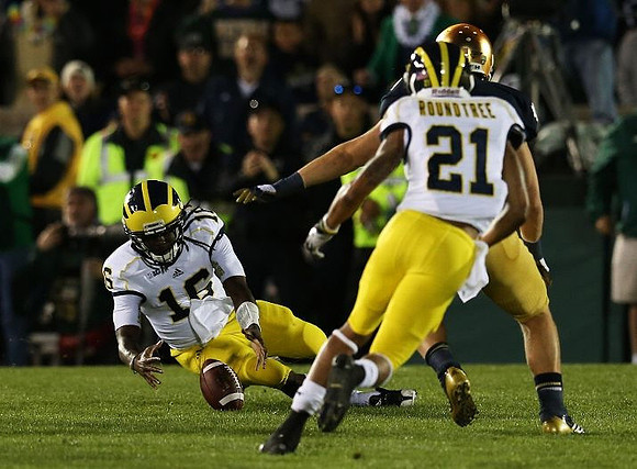 Denard Robinson (16) and Roy Roundtree (21)