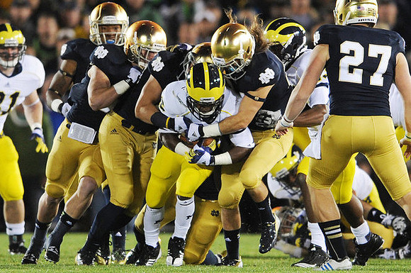 Mike Kwiatkowski (81) and Dennis Norfleet (26)