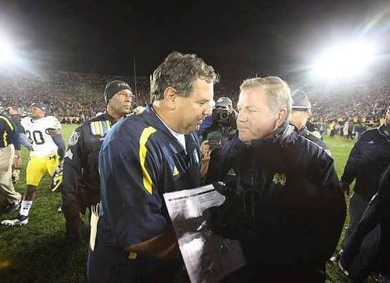 Thomas Gordon (30), Brady Hoke, and Brian Kelly