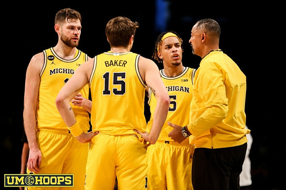 Hunter Dickinson (1), Joey Baker (15), Terrance Williams II (5), and Juwan Howard