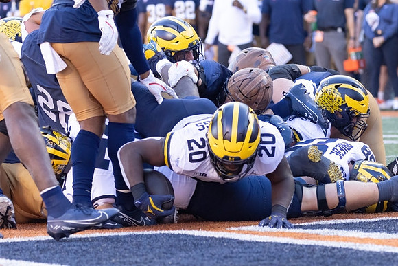 Kalel Mullings (20) and Josh Priebe (68)