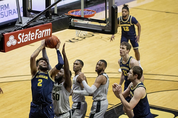 Isaiah Livers (2), Hunter Dickinson (1), Franz Wagner (21), and Mike Smith (12)