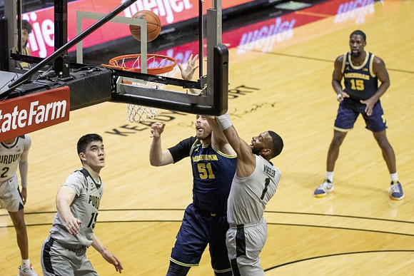 Austin Davis (51) and Chaundee Brown Jr. (15)