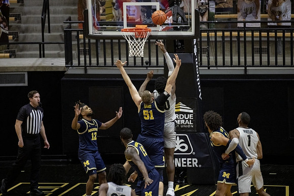 Mike Smith (12), Chaundee Brown Jr. (15), Austin Davis (51), and Isaiah Livers (2)