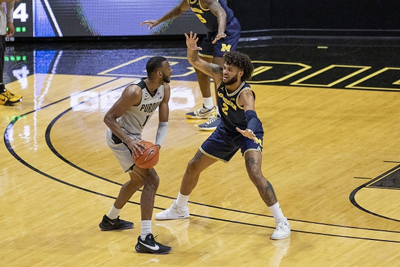 Chaundee Brown Jr. (15) and Isaiah Livers (2)