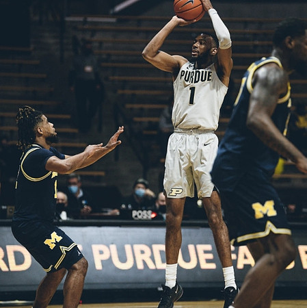 Mike Smith (12) and Chaundee Brown Jr. (15)