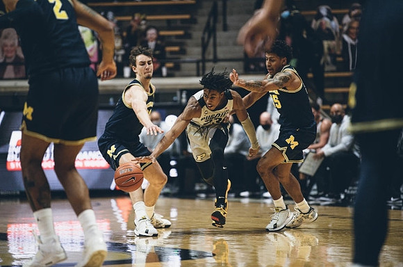 Isaiah Livers (2), Franz Wagner (21), and Eli Brooks (55)