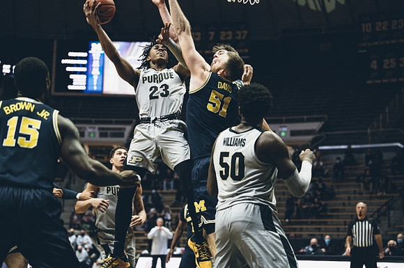 Chaundee Brown Jr. (15) and Austin Davis (51)