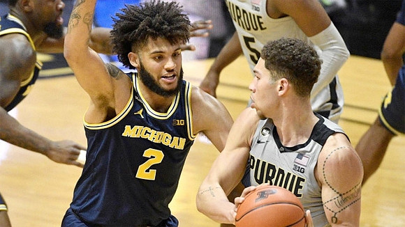 Chaundee Brown Jr. (15) and Isaiah Livers (2)