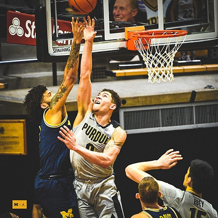 Isaiah Livers (2) and Austin Davis (51)