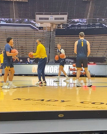 Eli Brooks (55), Juwan Howard, Franz Wagner (21), and Hunter Dickinson (1)