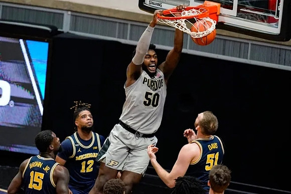 Chaundee Brown Jr. (15), Mike Smith (12), and Austin Davis (51)