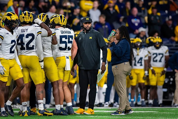 Will Johnson (2), TJ Guy (42), Mason Graham (55), and Sherrone Moore