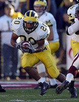 Michael Hart (20) and Chad Henne (7)
