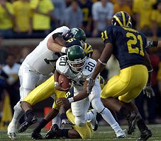 Prescott Burgess (6) and Safety Ryan Mundy (21)