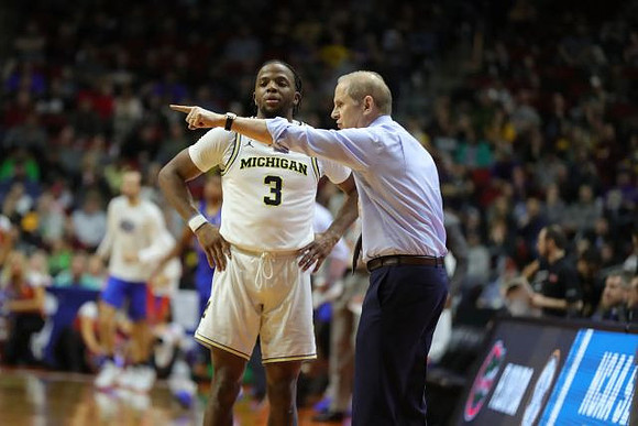 Zavier Simpson (3) and John Beilein