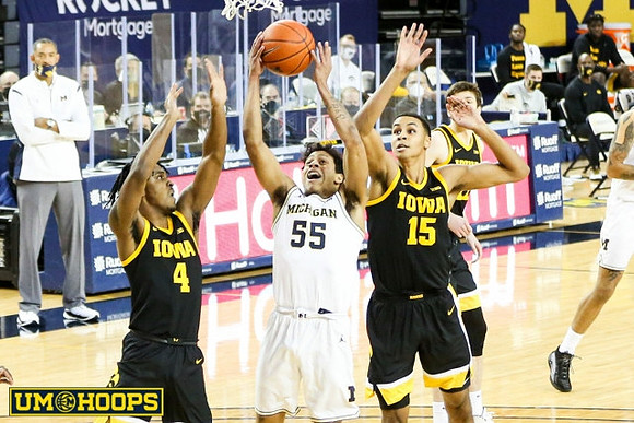 Eli Brooks (55) and Juwan Howard