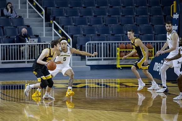 Terrance Williams II (5) and Hunter Dickinson (1)