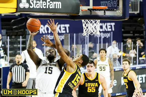 Chaundee Brown Jr. (15) and Eli Brooks (55)