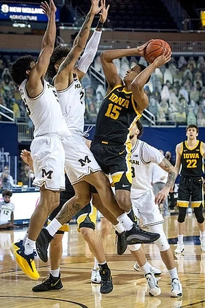 Eli Brooks (55), Isaiah Livers (2), and Brandon Johns Jr. (23)