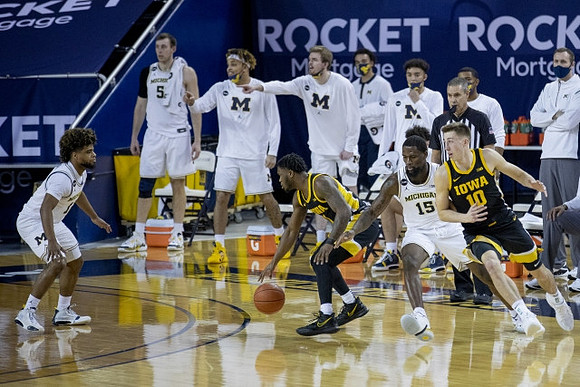 Mike Smith (12) and Chaundee Brown Jr. (15)