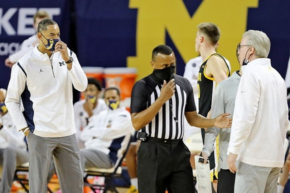 Juwan Howard and Iowa Head Coach Fran McCaffery
