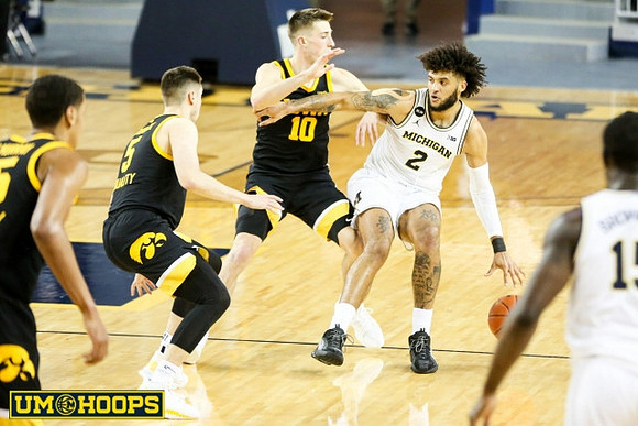 Isaiah Livers (2) and Chaundee Brown Jr. (15)