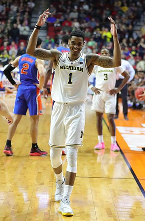 Charles Matthews (1) and Zavier Simpson (3)