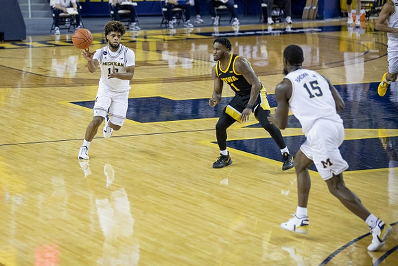Mike Smith (12) and Chaundee Brown Jr. (15)
