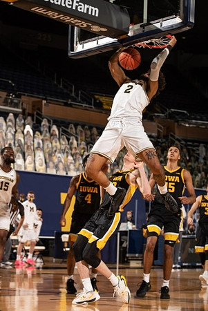 Isaiah Livers (2) and Chaundee Brown Jr. (15)