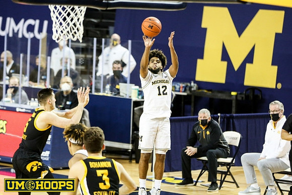 Mike Smith (12) and Iowa Head Coach Fran McCaffery