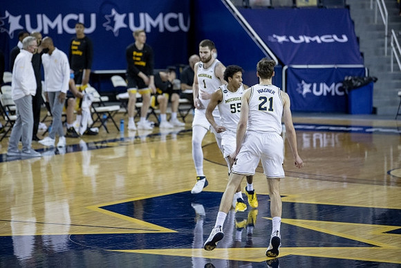 Hunter Dickinson (1), Eli Brooks (55), and Franz Wagner (21)