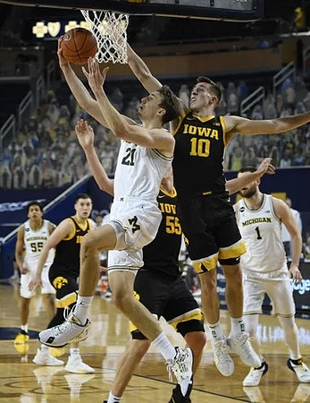 Franz Wagner (21), Eli Brooks (55), and Hunter Dickinson (1)