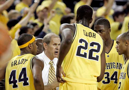 Kelvin Grady, John Beilein, Ekpe Udoh, DeShawn Sims, and C.J. Lee