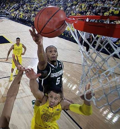 Jordan Morgan (52) and Trey Burke (3)