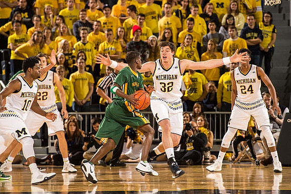 Derrick Walton Jr. (10), Duncan Robinson (22), Ricky Doyle (32), and Aubrey Dawkins (24)