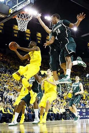 Caris LeVert (23) and Mitch McGary (4)